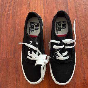 Women’s black and white keds